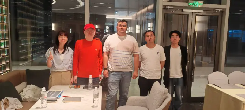 ​Liesa discusses business with a Central Asian client